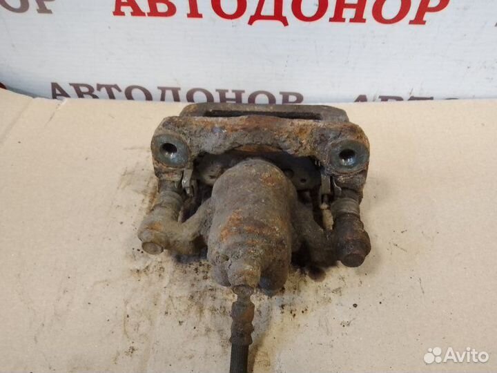 Суппорт тормозной задний левый Nissan Pathfinder