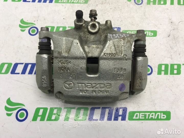 Суппорт тормозной передний правый Mazda 3 BP PE