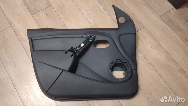 Обшивка (карта) двери передняя левая Renault