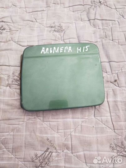 Лючок бензобака Ниссан Альмера