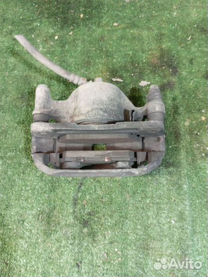 Суппорт тормозной передний левый Hyundai Accent