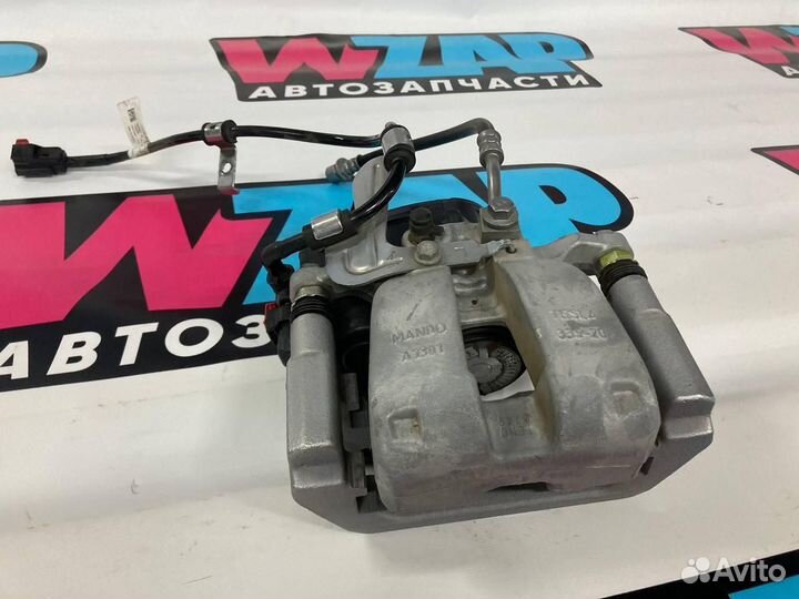 Суппорт тормозной задний левый Tesla Model 3