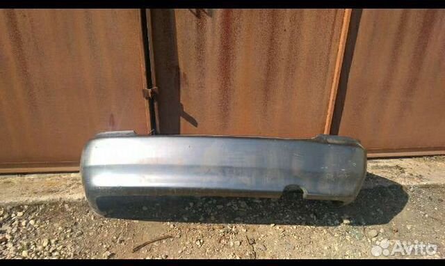 Бампер задний Мазда 323 BA