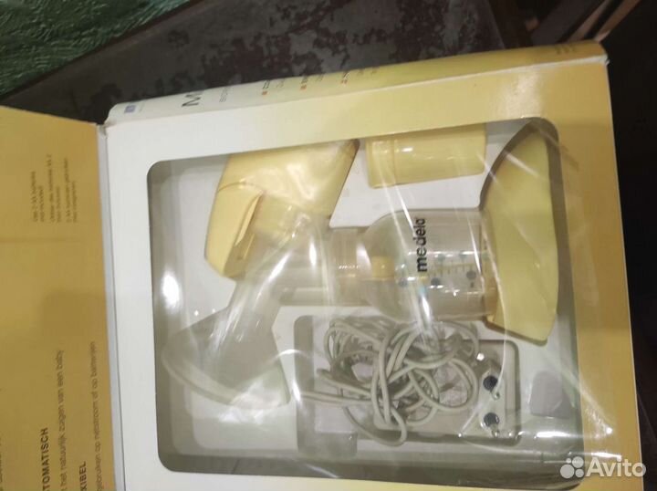 Молокоотсос medela электрический