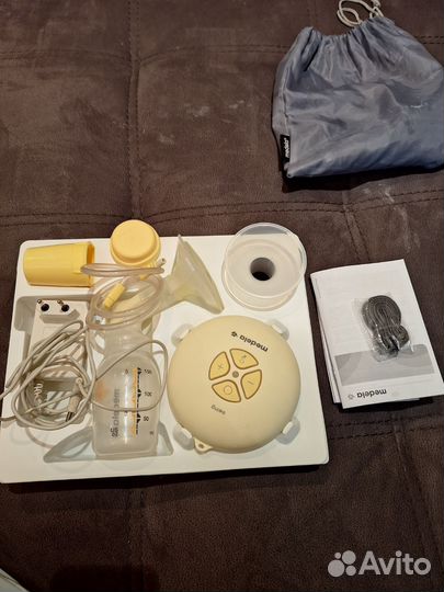 Молокоотсос medela swing электрический