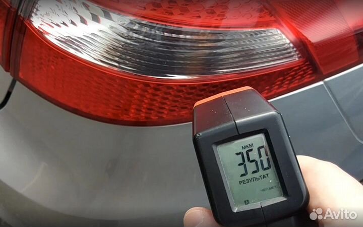 Проверка кузова Tesla на стапеле, толщиномером