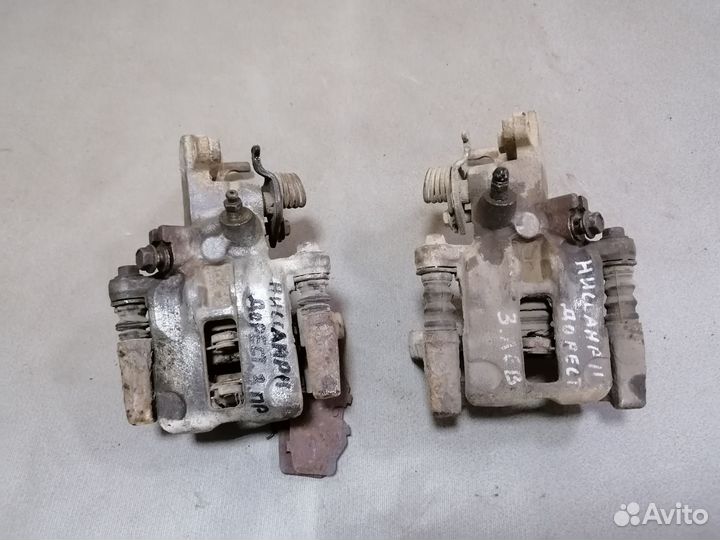 Суппорт тормозной задний Nissan Primera P11