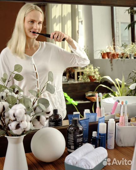 Электрическая зубная щетка