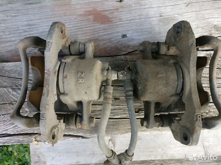 Суппорт Mazda 323 BJ Familia левый правый