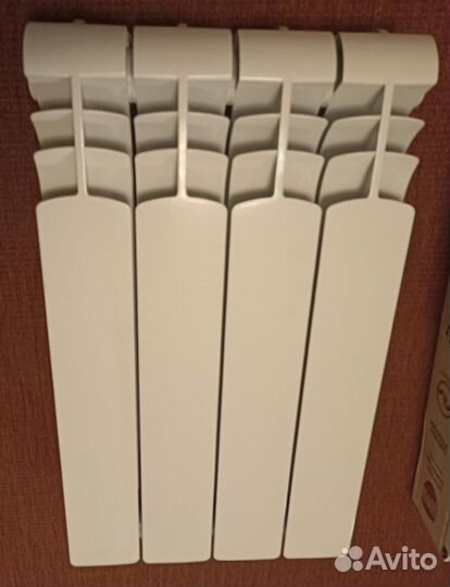 Новый биметаллический радиатор 4 секции h 560 мм