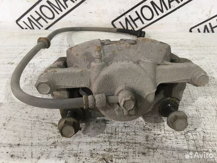 Суппорт тормозной передний левый Nissan Кашкай