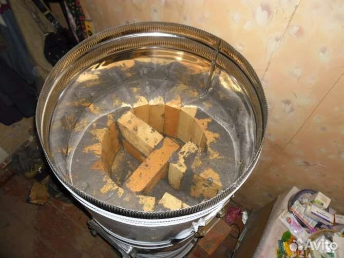 Печь кирпичная круглая в футляре из нержавейки