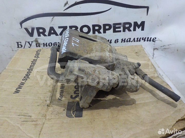 Суппорт тормозной передний левый Toyota Corona