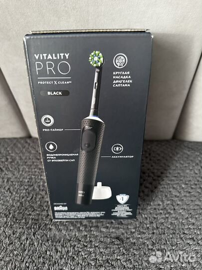 Новая электрическая зубная щетка oral B