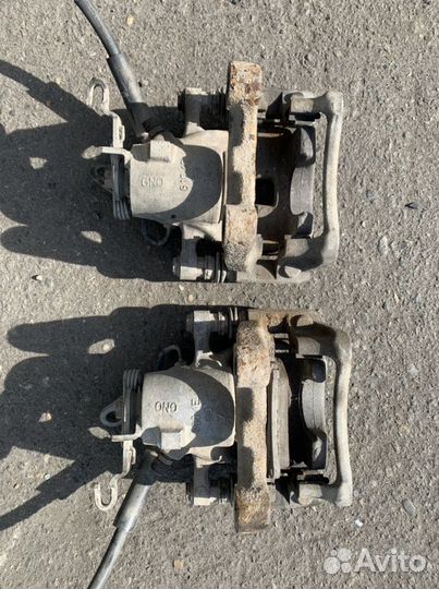 Суппорт тормозной задний Skoda Superb 2