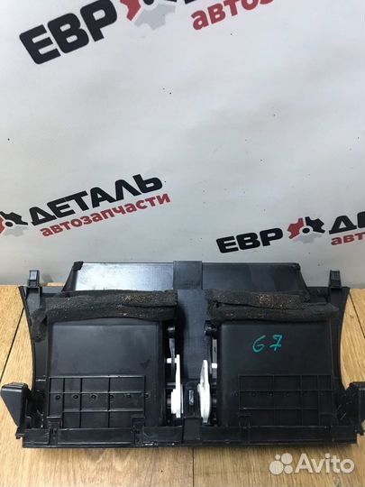 Дефлектор воздушный центральный Geely Emgrand X7