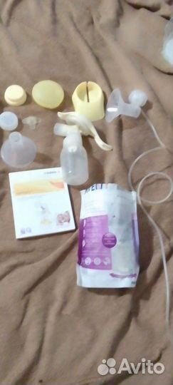 Молокоотсос ручной medela новый