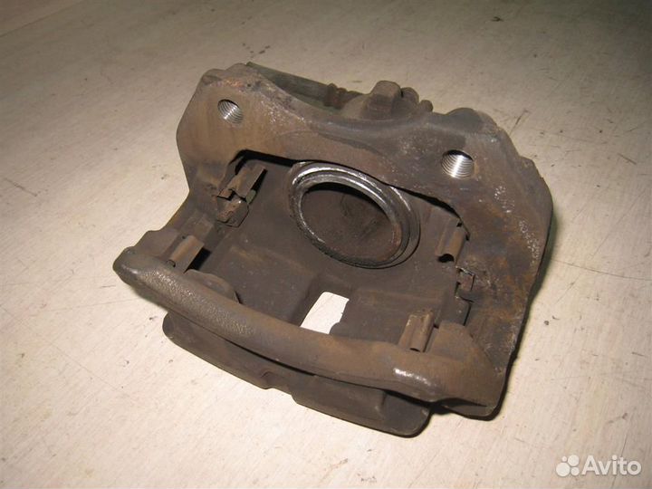 Суппорт тормозной передний левый Nissan Almera Ti