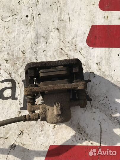 Суппорт тормозной задний левый Land Rover Freeland