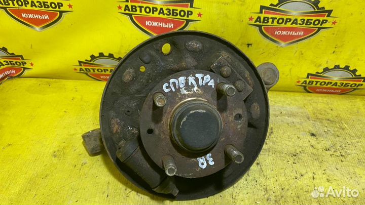 Кулак со ступицей задний левый Kia Spectra
