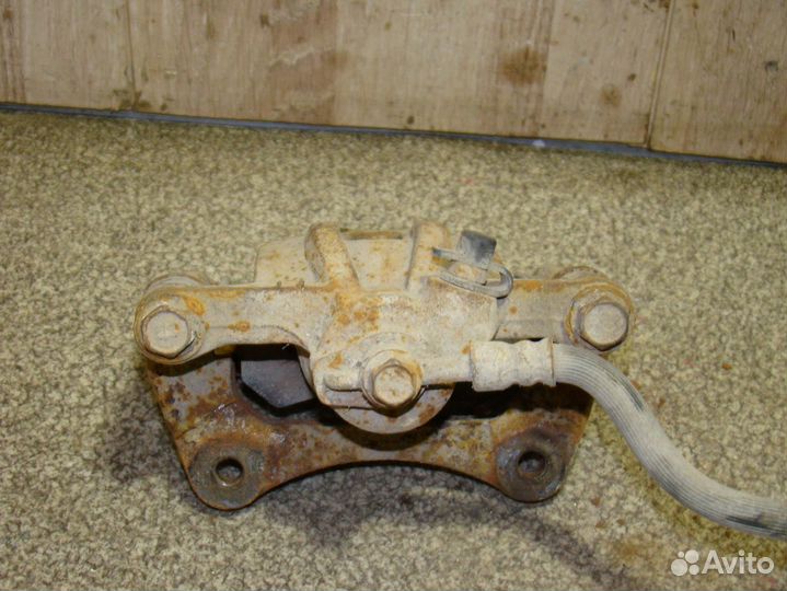 Суппорт задний левый Chevrolet Lacetti