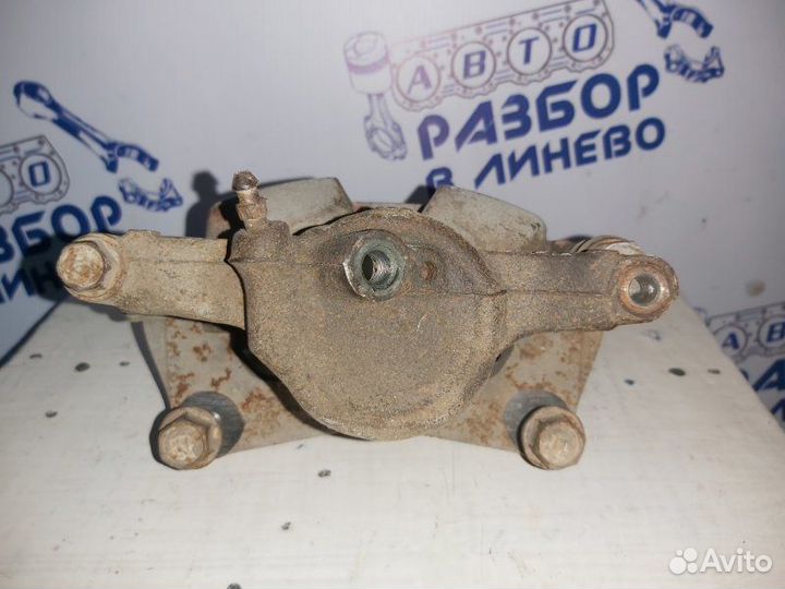 Суппорт тормозной левый Toyota Carina AT191