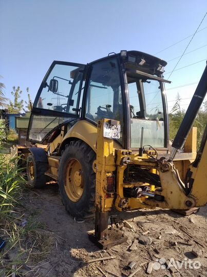 Экскаватор погрузчик caterpillar услуги