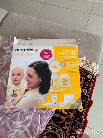 Молокоотсос medela электрический