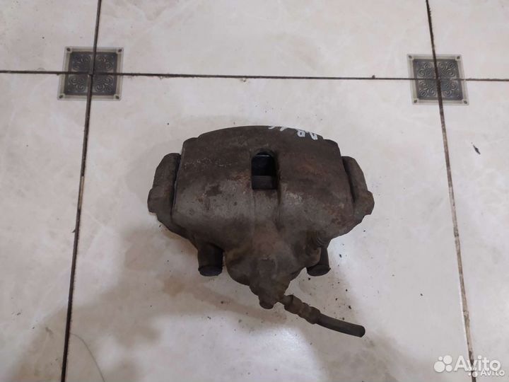 Тормозной суппорт передний правый Skoda Rapid