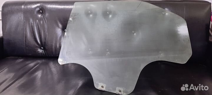 Стекло задней левой двери Рено Логан/Сандеро 04-14