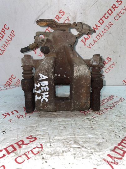 Суппорт тормозной задний левый Toyota Avensis T270