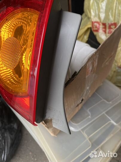 Фонарь задний левый Toyota Corolla E150 оригинал