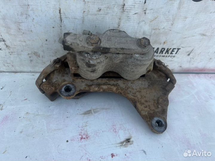 Суппорт тормозной передний левый Chevrolet Niva