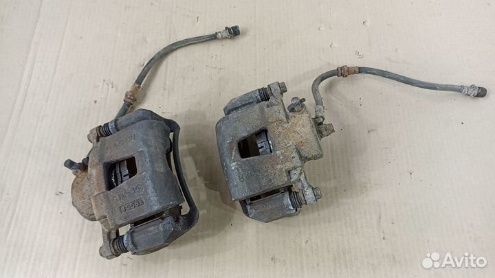 Суппорт тормозной левый правый Шевроле Лачетти