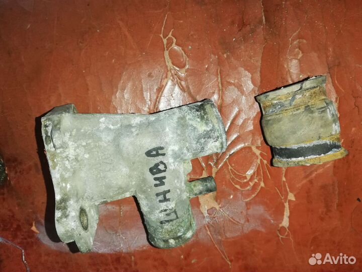 Патрубок отводящий Нива Шевроле