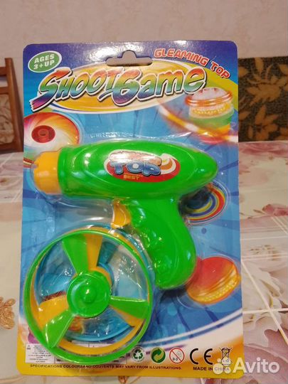 Вертушка юла с запуском, свет. Вертушка-пистолет