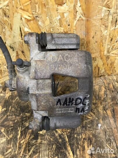 Суппорт тормозной передний левый Chevrolet Lanos