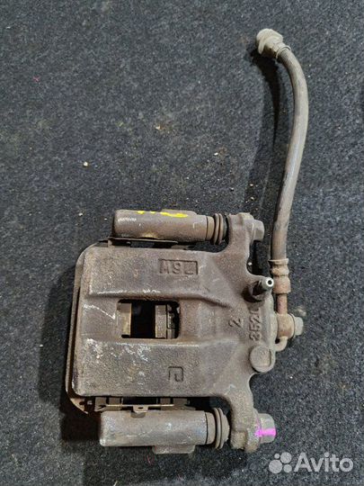 Суппорт тормозной задний левый Nissan X-Trail T31