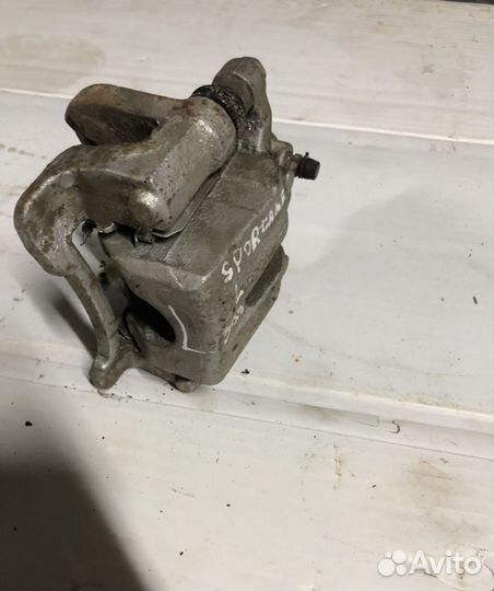 Суппорт задний левый Kia Sportage 3 Hyundai ix 35