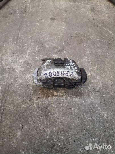 Суппорт тормозной передний правый Mazda 3 BL