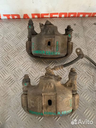 Суппорт тормозной левый Тойота Королла EE107V