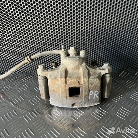 Суппорт тормозной передний правый Mitsubishi Outla