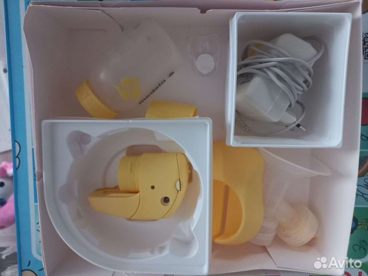 Молокоотсос medela электрический