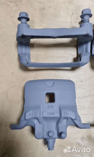 Суппорт тормозной передний Nissan