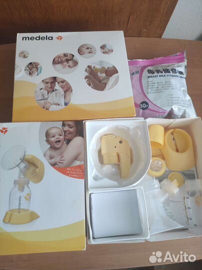 Молокоотсос medela электрический