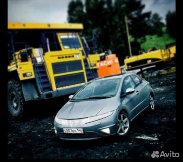 Машинист колесного бульдозера Komatsu wd 600