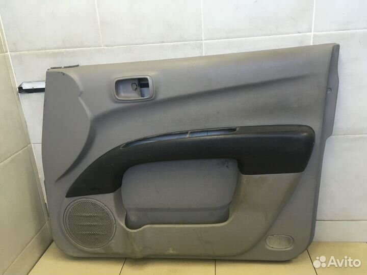 Обшивка двери передней правой L200 (KB) 2006-2016