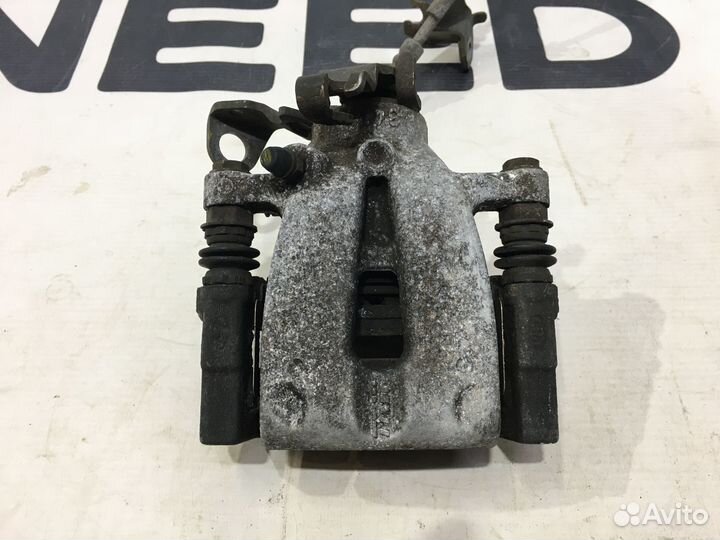 Суппорт тормозной задний левый Kia Venga 2009-2019