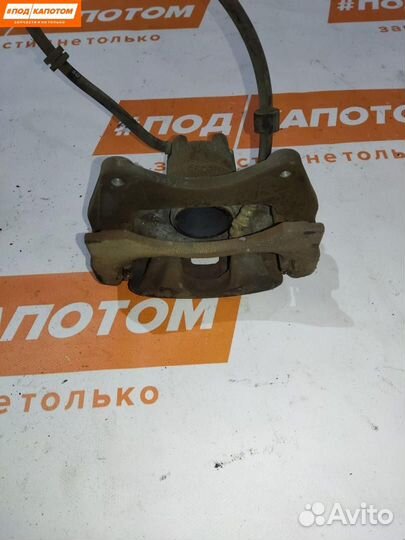 Суппорт тормозной передний левый Mitsubishi Lancer