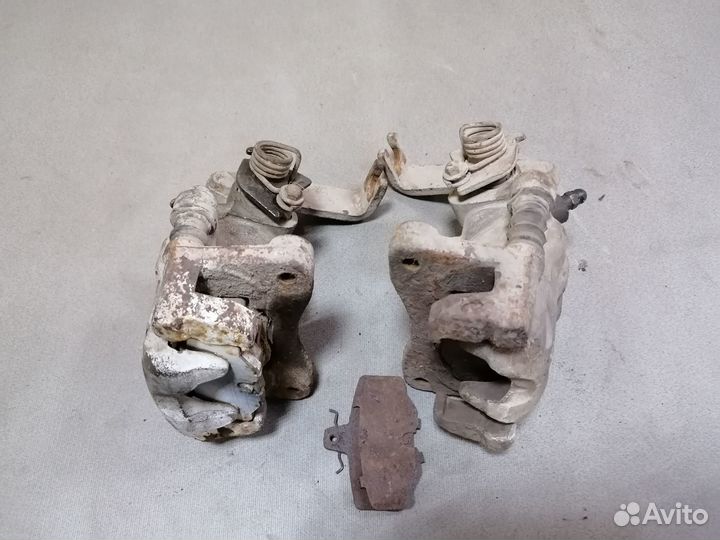 Суппорт тормозной задний Nissan Primera P11